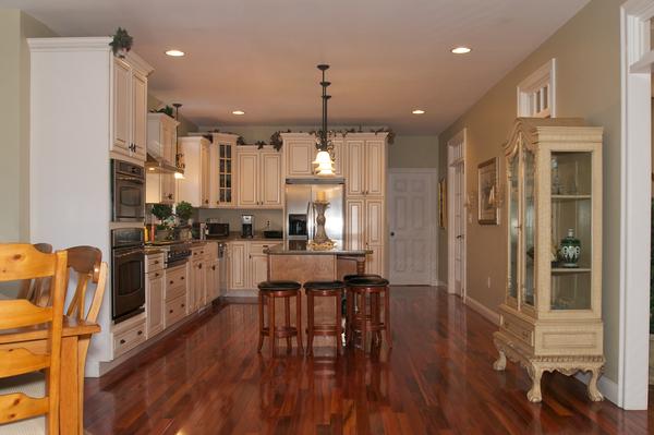 4 Devonshire Road Amesbury, MA 01913 - Photo 6 of 23 a kitchen with stainless steel appliances kitchen island granite countertop furniture wooden floor and a kitchen view