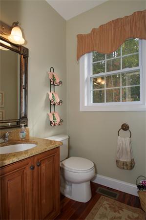 4 Devonshire Road Amesbury, MA 01913 - Photo 10 of 23 a bathroom with a toilet sink and mirror