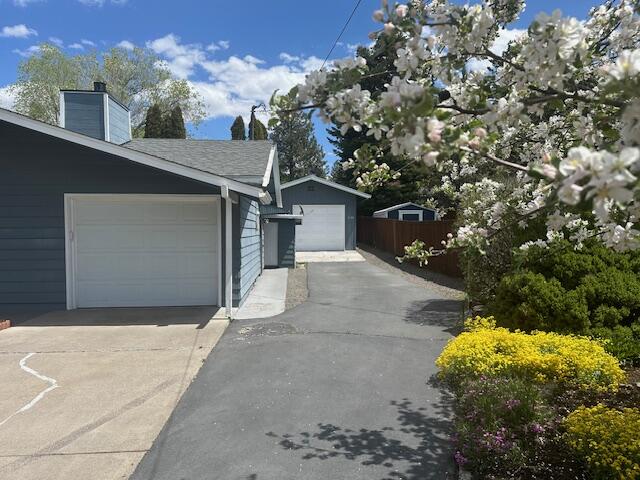2188 Northeast Shepard Road Bend, OR 97701 - Photo 2 of 52 Extra shop/garage with paved driveway. Not shown are the RV carport, extra shed, and greenhouse.