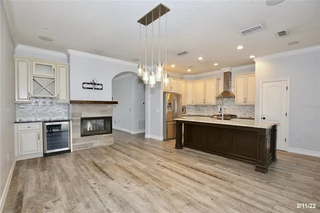 a kitchen with a sink appliances and cabinets