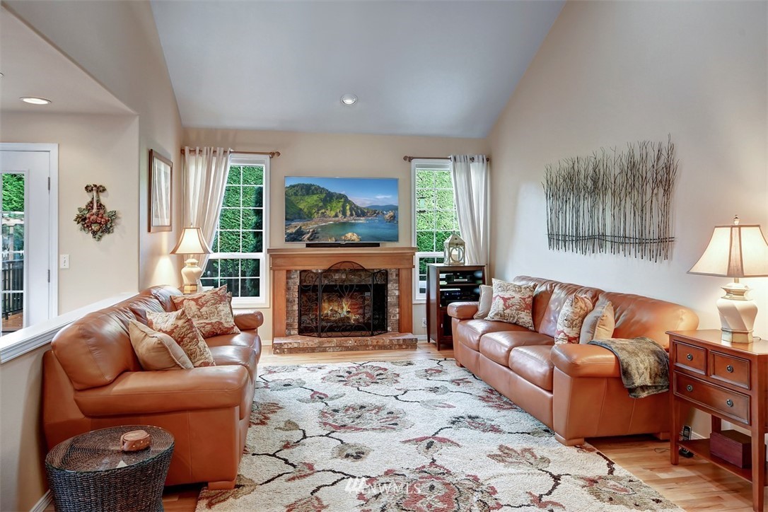 15420 Southeast 133rd Street Renton, WA 98059 - Photo 12 of 26 a living room with furniture and a fireplace