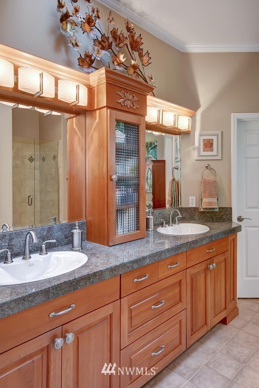 15420 Southeast 133rd Street Renton, WA 98059 - Photo 16 of 26 a bathroom with a granite countertop sink and a mirror