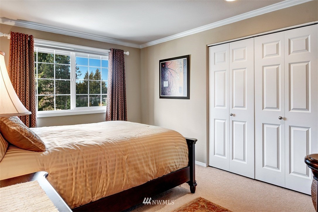 15420 Southeast 133rd Street Renton, WA 98059 - Photo 19 of 26 a bedroom with a bed and a window with outer view