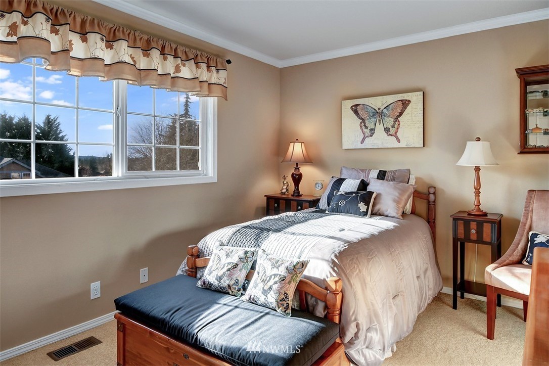 15420 Southeast 133rd Street Renton, WA 98059 - Photo 20 of 26 a bedroom with bed and window