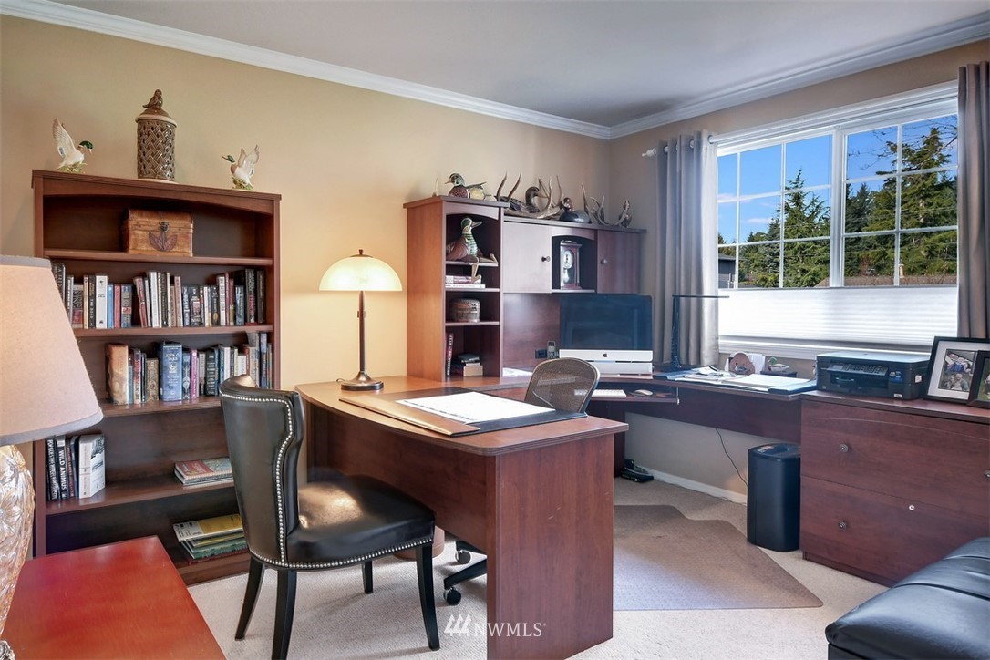 15420 Southeast 133rd Street Renton, WA 98059 - Photo 22 of 26 a view of a workspace with furniture and a bookshelf
