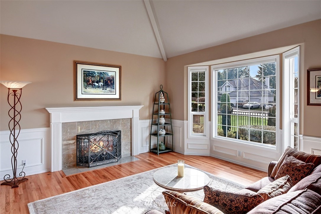 15420 Southeast 133rd Street Renton, WA 98059 - Photo 4 of 26 a living room with furniture and a fireplace