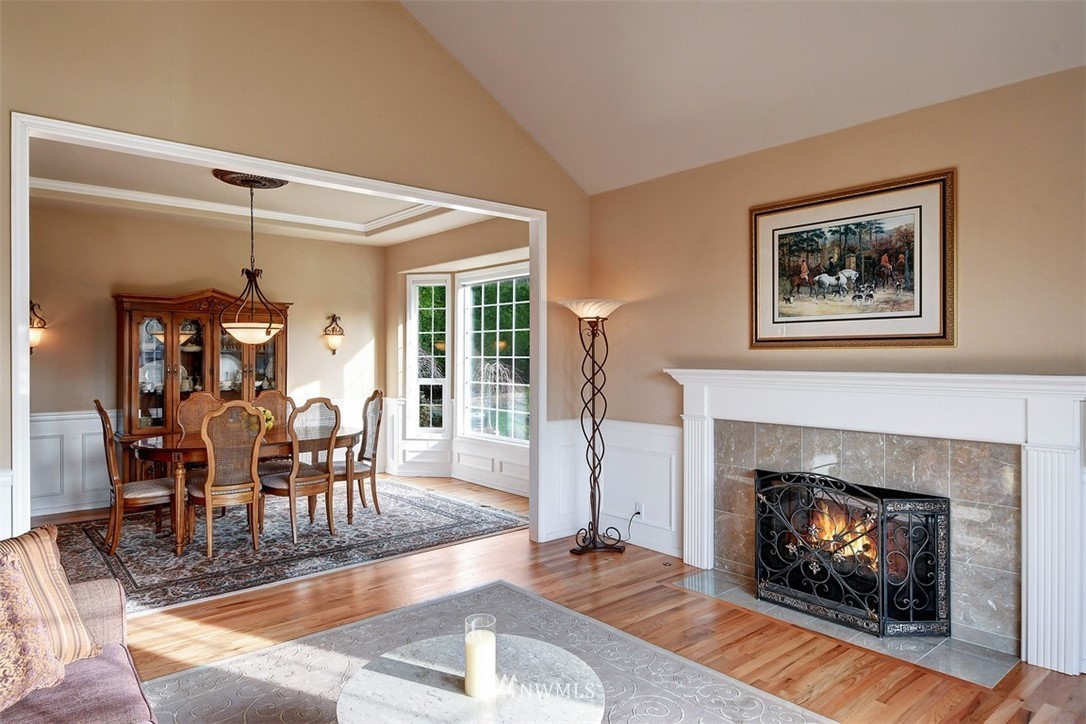 15420 Southeast 133rd Street Renton, WA 98059 - Photo 5 of 26 a living room with furniture and a fireplace