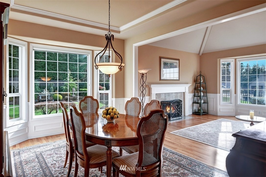 15420 Southeast 133rd Street Renton, WA 98059 - Photo 6 of 26 a view of a dining room with furniture window and wooden floor