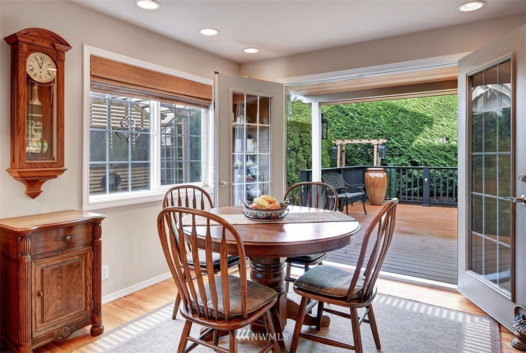 15420 Southeast 133rd Street Renton, WA 98059 - Photo 9 of 26 a dining room with furniture a chandelier and wooden floor