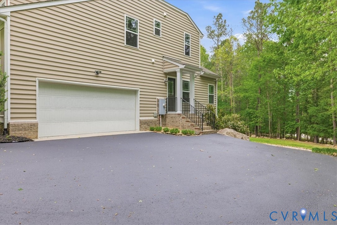 12401 Duntrune Court Chesterfield, VA 23838 - Photo 5 of 8 The home offers a side load garage and a side door