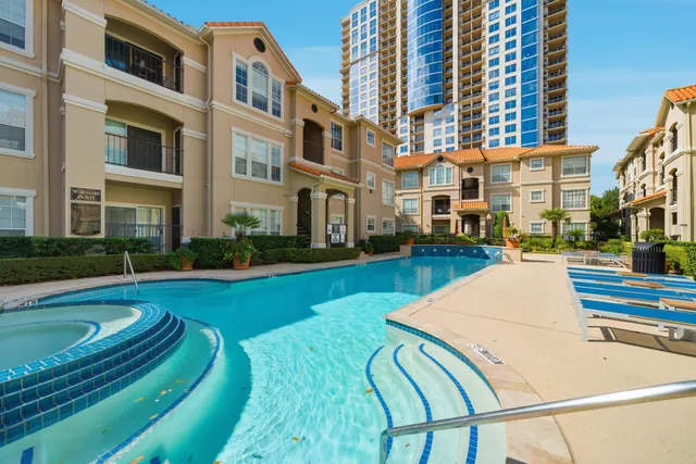 a view of a swimming pool with a lounge chairs