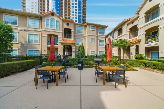 a view of a building with sitting area