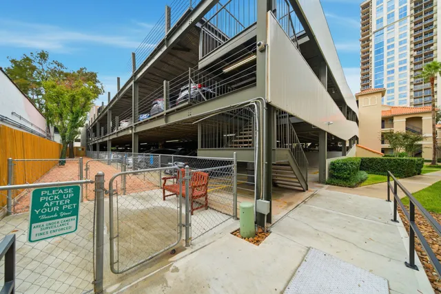 a view of balcony with wooden floor and fence
