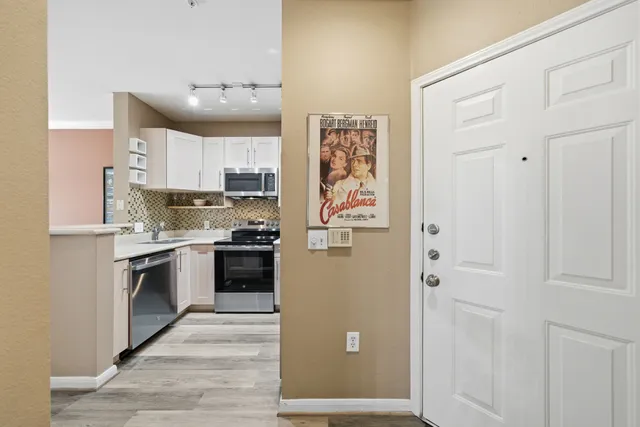 a kitchen with stainless steel appliances cabinets and a counter top space