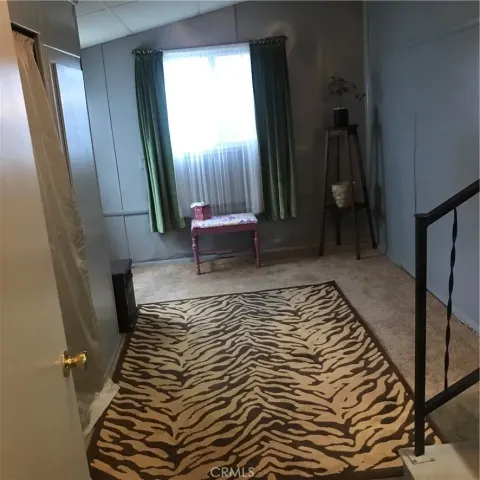 a bath room with a toilet and a shower