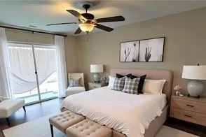 a bedroom with a bed and a large window