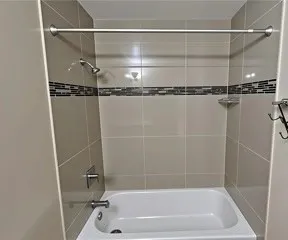 a close view of a bathtub in bathroom