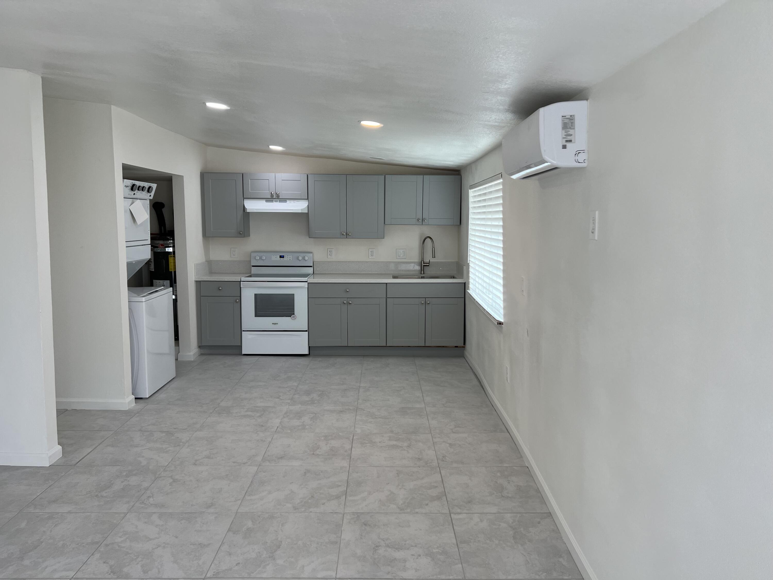 2542 Seaview Drive, Unit 4 Thermal, CA 92274 - Photo 1 of 3 a large kitchen with a stove top oven and refrigerator