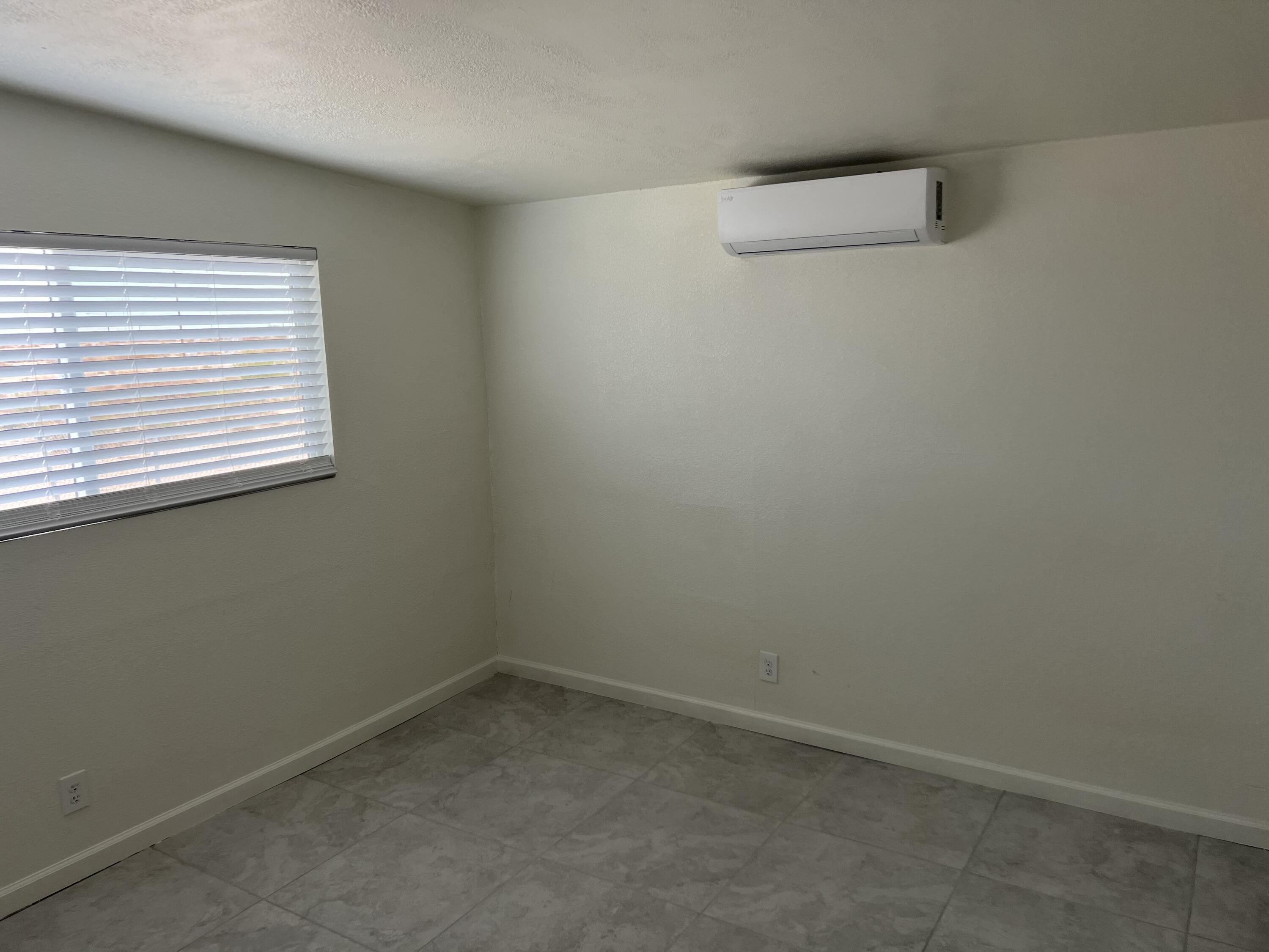 2542 Seaview Drive, Unit 4 Thermal, CA 92274 - Photo 2 of 3 an empty room with a window