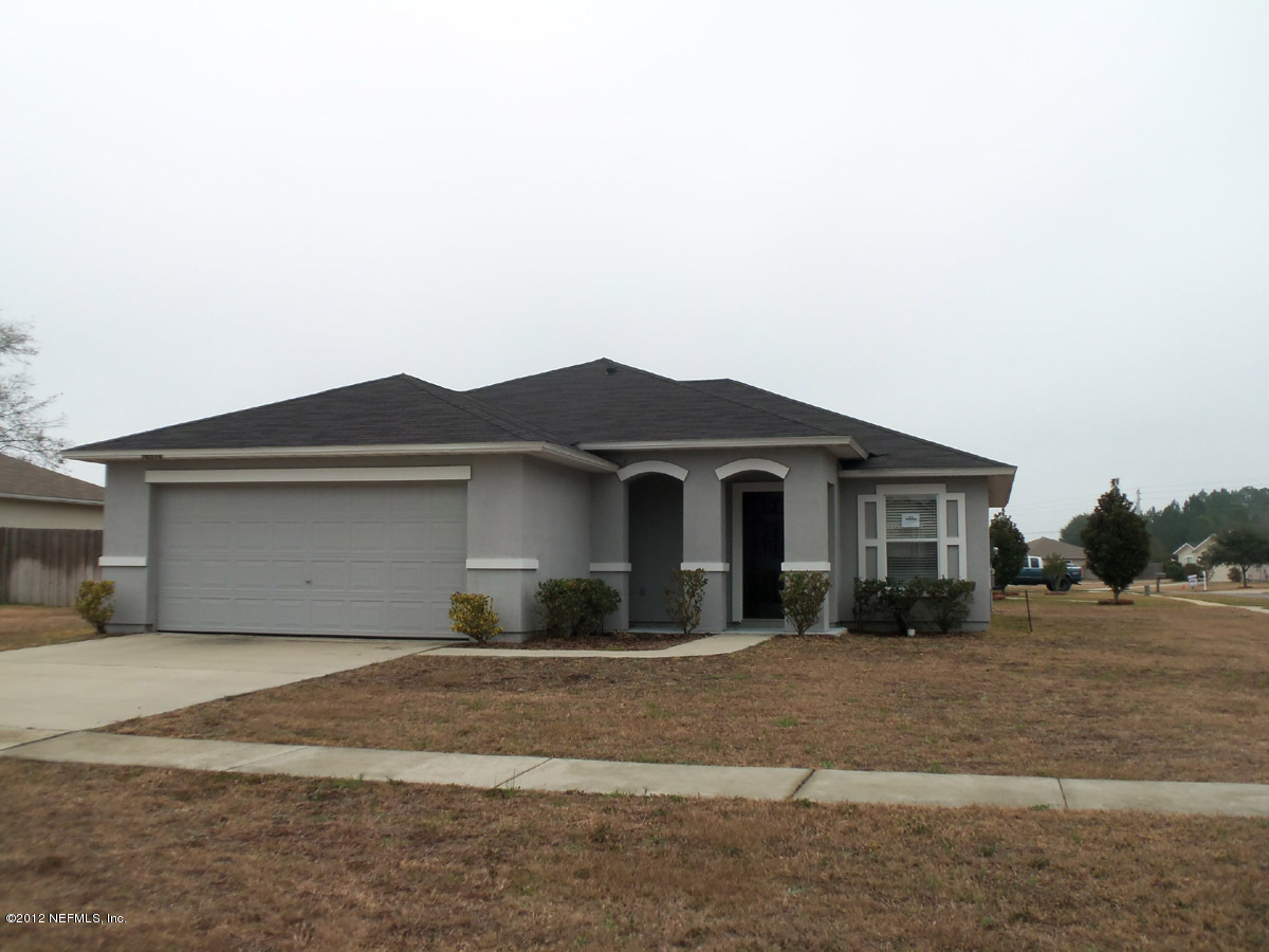 76016 Long Pond Loop Yulee, FL 32097 - Photo 1 of 8 Front