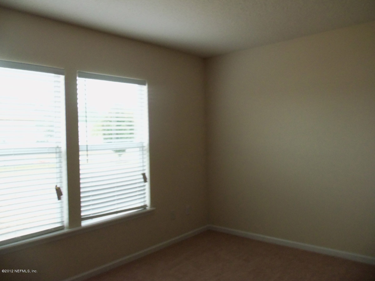 76016 Long Pond Loop Yulee, FL 32097 - Photo 6 of 8 Master Bedroom