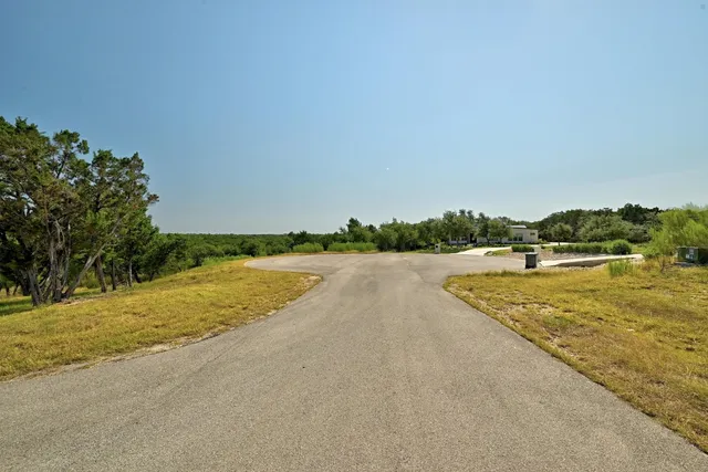 a view of a lake with houses in the back