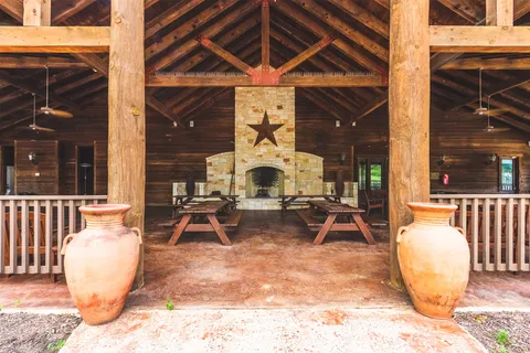 a view of a table and chairs in the patio