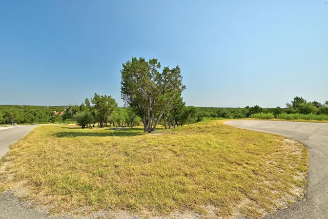 a swimming pool with an outdoor space and seating