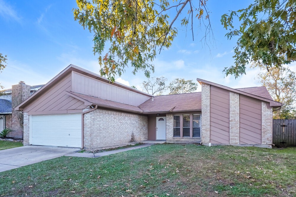 20117 Dawn Mist Drive Humble, TX 77346 - Photo 3 of 16 a view of a house with a yard and a tree
