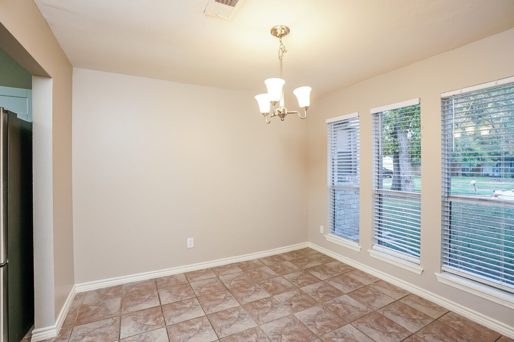 20117 Dawn Mist Drive Humble, TX 77346 - Photo 7 of 16 a view of an empty room with a window