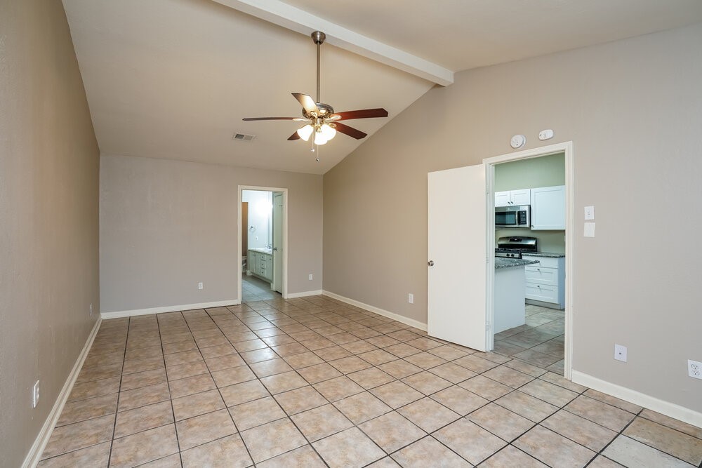 20117 Dawn Mist Drive Humble, TX 77346 - Photo 10 of 16 an empty room and chandelier fan in a room
