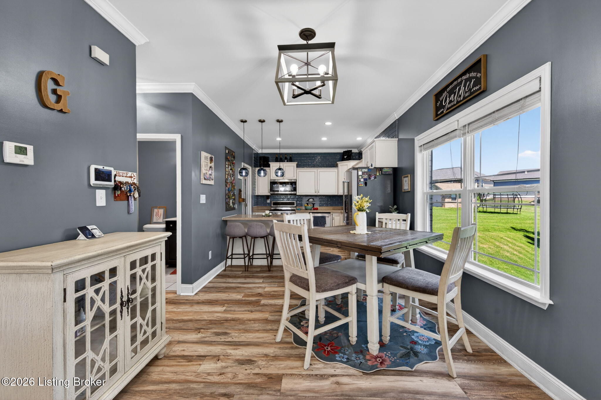 142 Highland Ridge Drive Mount Washington, KY 40047 - Photo 14 of 61 A gorgeous light fixture, recessed lighting, and large windows give the dining space a bright, inviting feel