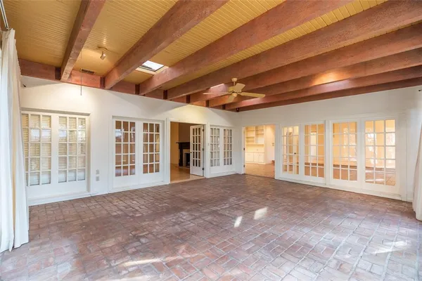 a view of an empty room with a balcony