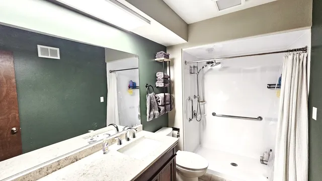 a bedroom with a bed and furniture