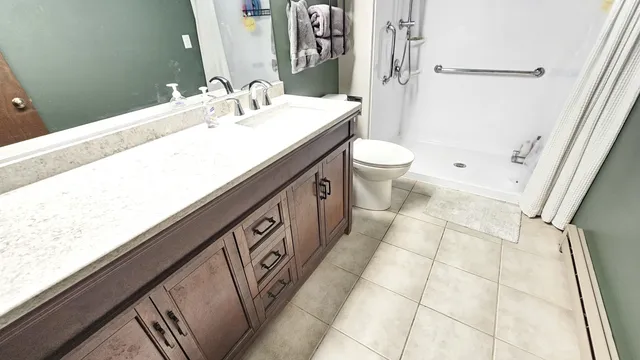 a bedroom with a bed and a mirror