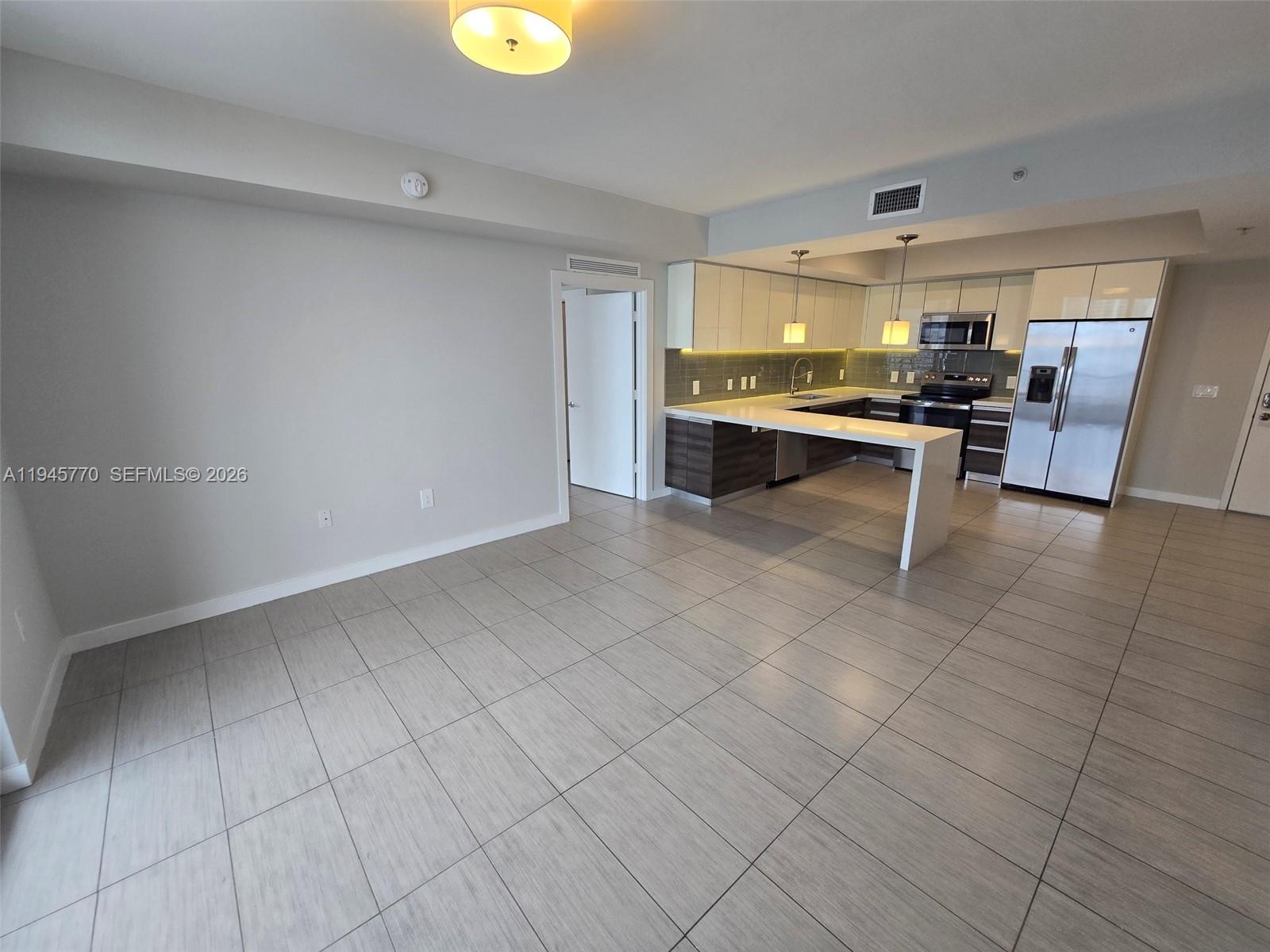 117 Southwest 10th Street, Unit 2206 Miami, FL 33130 - Photo 12 of 22 a view of kitchen with furniture and window
