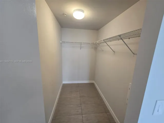 wooden floor in an empty room and a window
