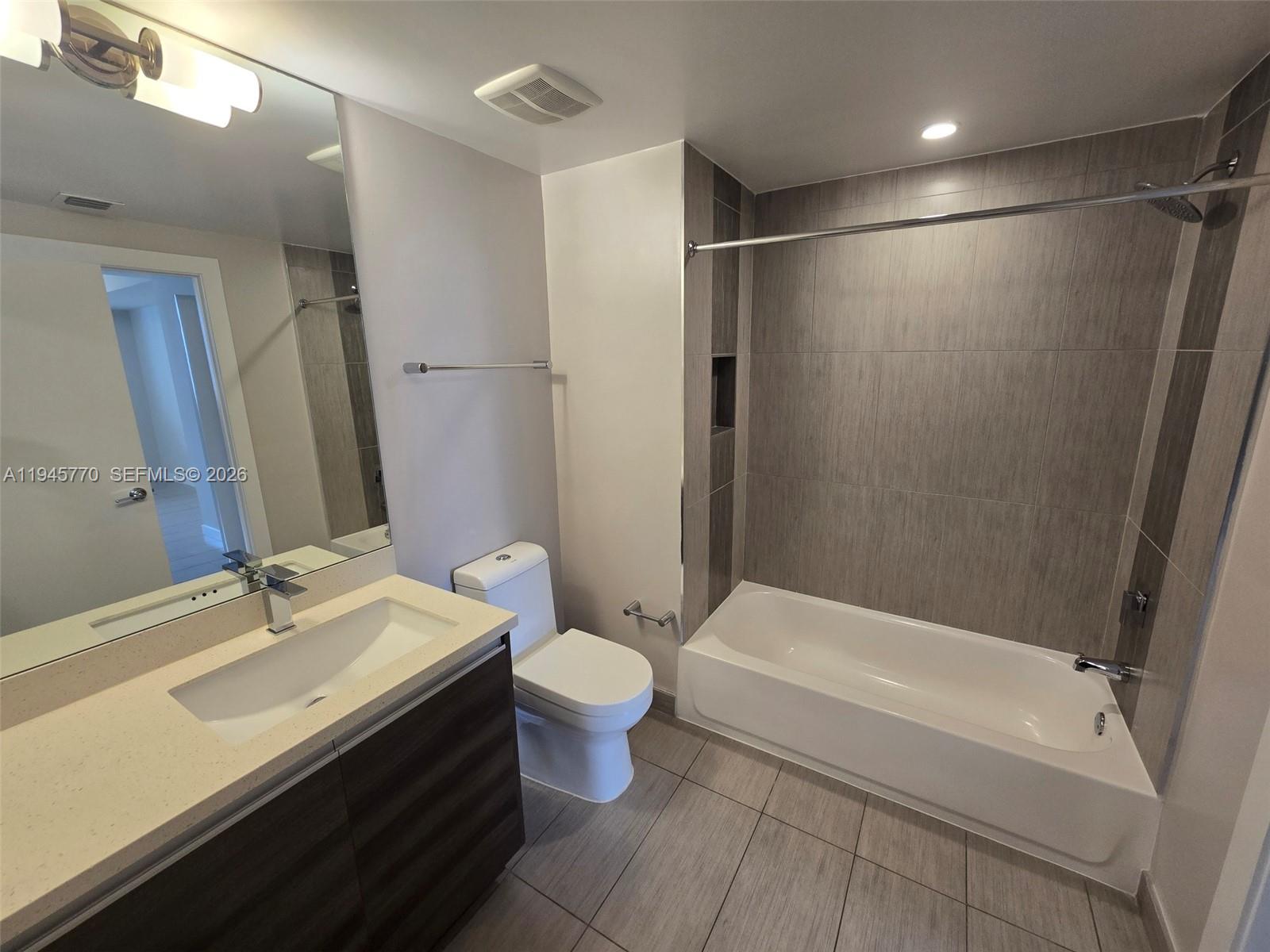 117 Southwest 10th Street, Unit 2206 Miami, FL 33130 - Photo 21 of 22 a bathroom with a sink toilet and shower