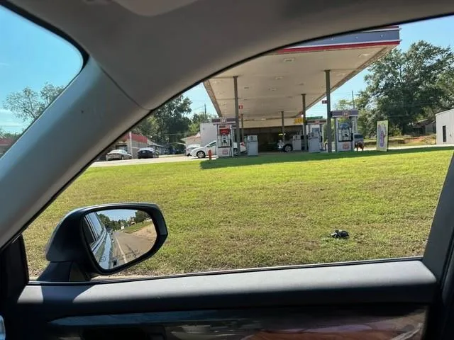 a view of a swimming pool with an outdoor space and seating area