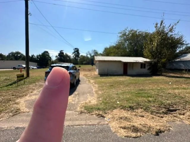 a view of a backyard with table and chairs