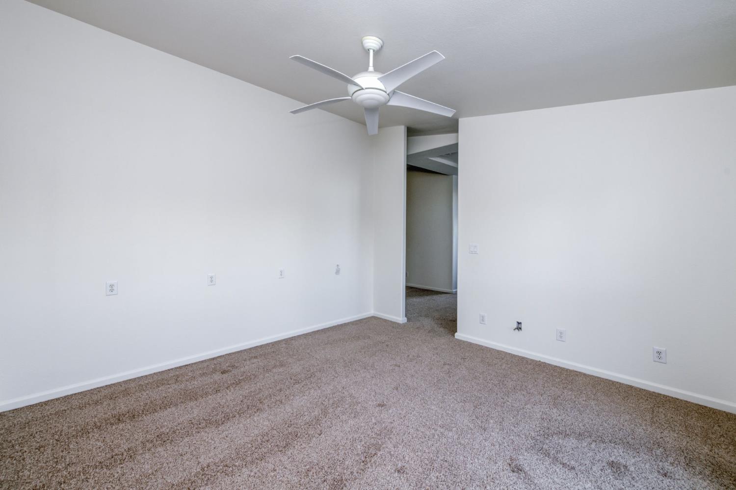 8646 Cairo Avenue Laton, CA 93242 - Photo 16 of 38 an empty room with closet and ceiling fan