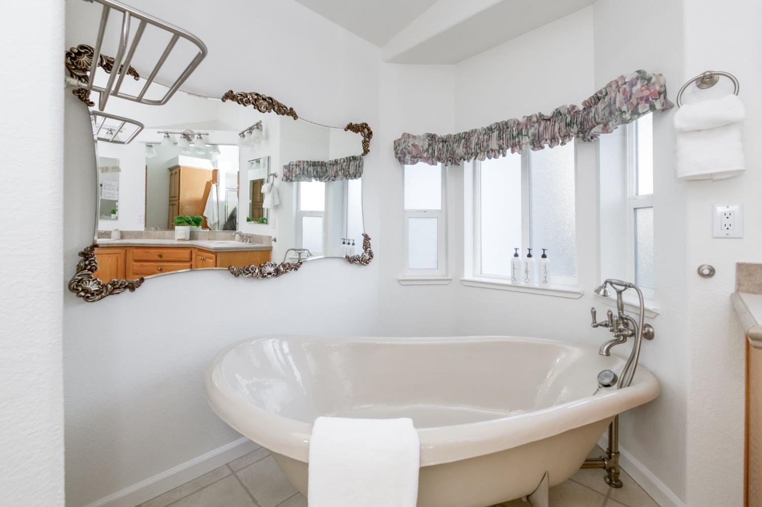 8646 Cairo Avenue Laton, CA 93242 - Photo 18 of 38 a white bath tub sitting in a bathroom next to a window