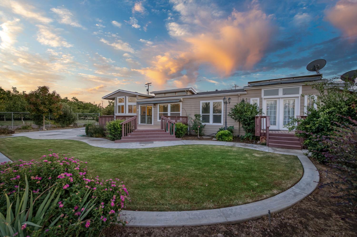 8646 Cairo Avenue Laton, CA 93242 - Photo 26 of 38 a view of a house with backyard sitting area and garden