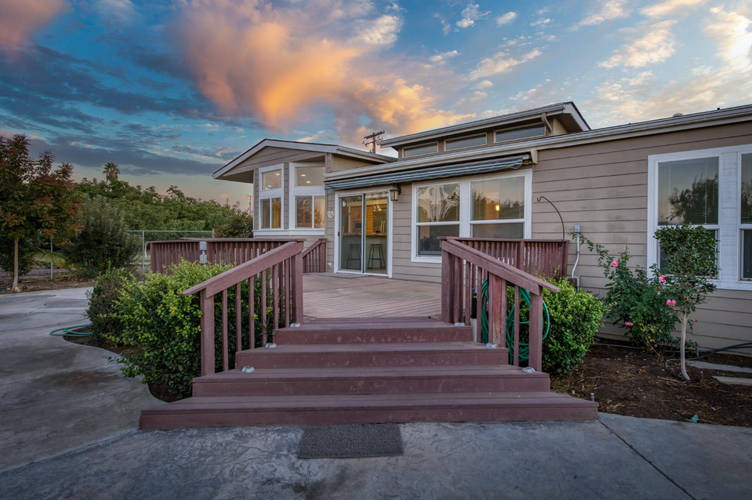 8646 Cairo Avenue Laton, CA 93242 - Photo 27 of 38 a view of a house with entrance stairs and a garden