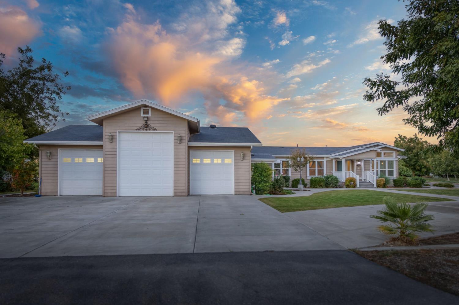 8646 Cairo Avenue Laton, CA 93242 - Photo 35 of 38 a front view of a house with a yard and garage