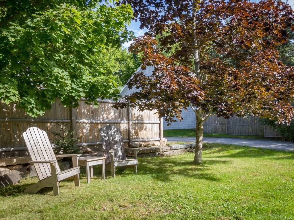 29 Jordan Pond Road Seal Harbor, ME 04675 - Photo 6 of 25 There is a privacy fence and stone...