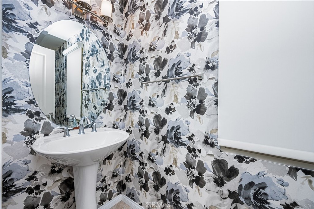 94 Capricorn Irvine, CA 92618 - Photo 11 of 47 a bathroom with a sink and a mirror