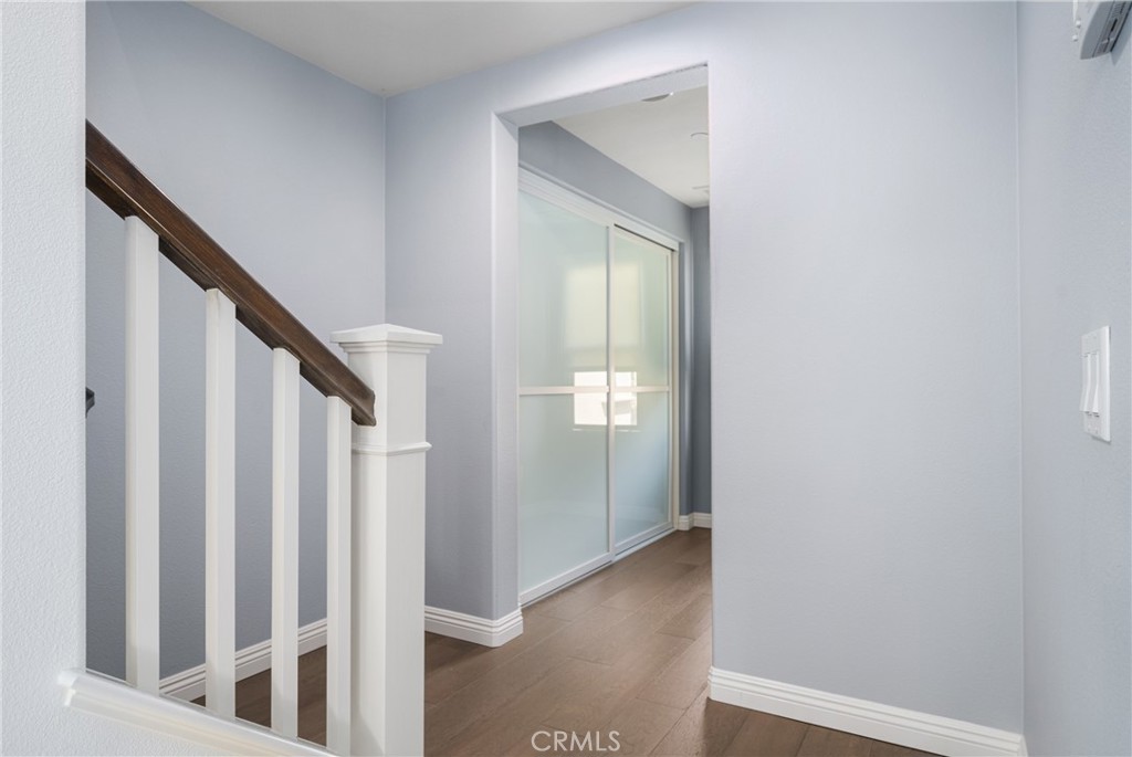 94 Capricorn Irvine, CA 92618 - Photo 16 of 47 a view of a hallway with wooden floor and entryway
