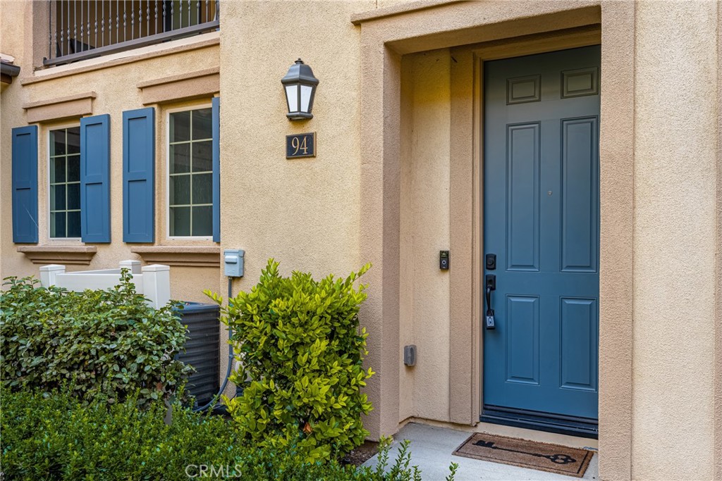 94 Capricorn Irvine, CA 92618 - Photo 2 of 47 front view of door with an outdoor space