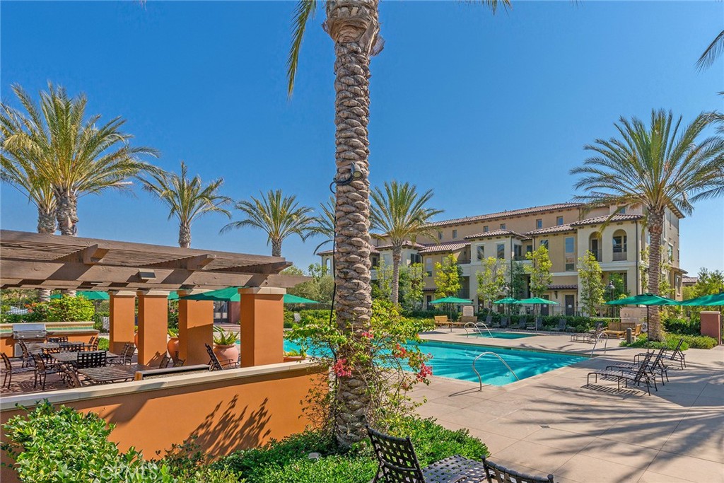 94 Capricorn Irvine, CA 92618 - Photo 36 of 47 a front view of multiple houses with yard